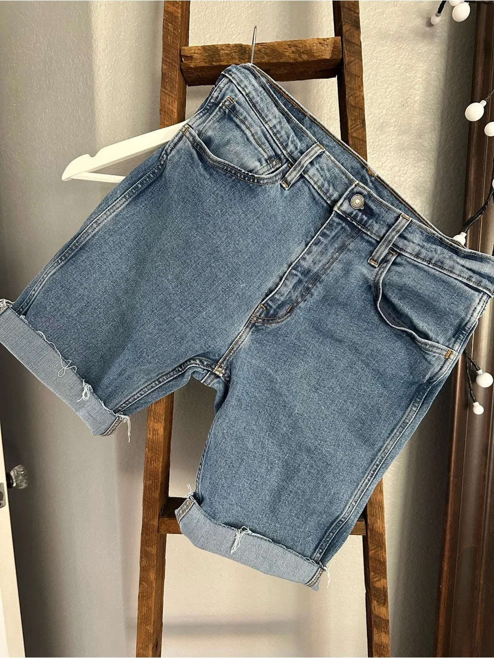 Levi's blue long cut off shorts, size 32